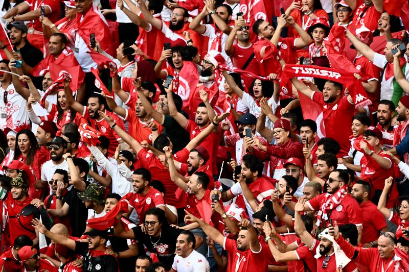 Tunisia fans chant in the stands during the game against Argentina. Photograph: Jewel Samad/AFP via Getty Images