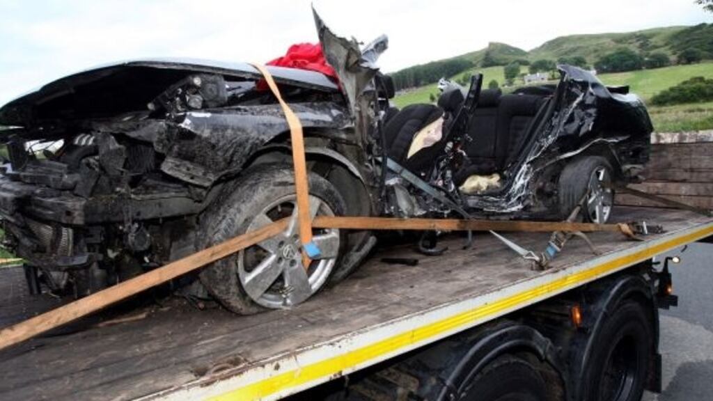 A car in which seven men died is taken away from the scene of a crash in Co Donegal. Photograph: Paul Faith/PA Wire.