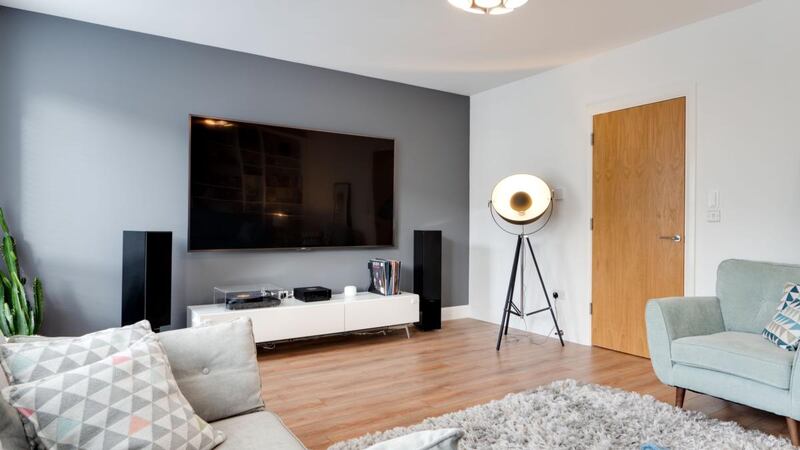 Entertainment room with 85-inch TV that comes with the house