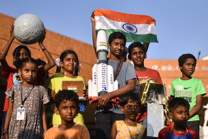 Children display a replica of the Indian Space Research Organisation's Chandrayaan-3 spacecraft during a live streaming of its soft landing on the moon's south pole, at the Tamil Nadu Science and Technology Centre in Chennai, India, on August 23rd. Photograph: Idrees Mohammed/Shutterstock