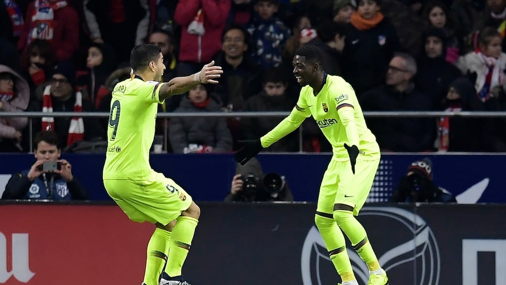 Barcelona’s Ousmane Dembélé celebrates with Luis Suarez after scoring a late equaliser during their La Liga meeting with Atletico Madrid. Photo: Oscar del Pozo/Getty Images