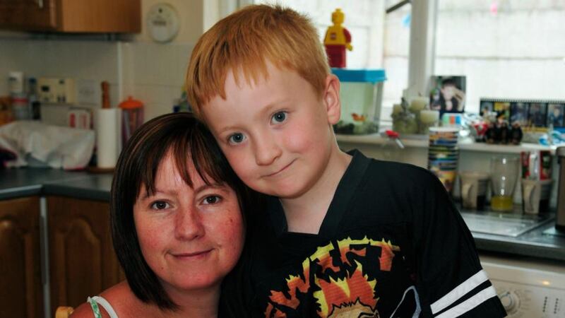 Max Dunne (6), who has asthma, with his mother, Orla,  in their home in Tallaght, Co Dublin. Photograph: Aidan Crawley