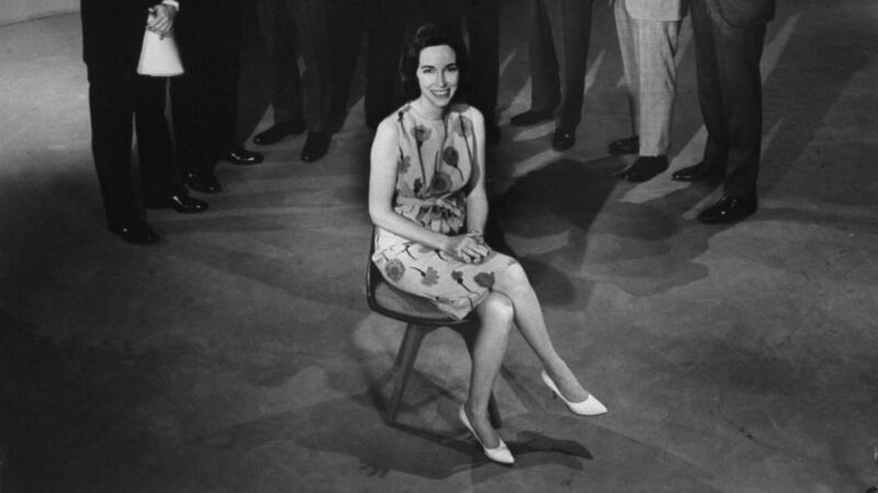 Author Helen Gurley Brown surrounded by men involved with her novel, Sex and the Single Girl. Photograph: Allan Grant/Time Life Pictures/Getty Images