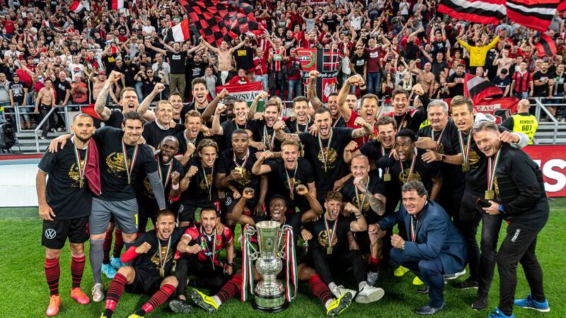 Budapest Honved celebrate their win with fans in the background. Photo: Zsolt Szigetvary/MTI via AP