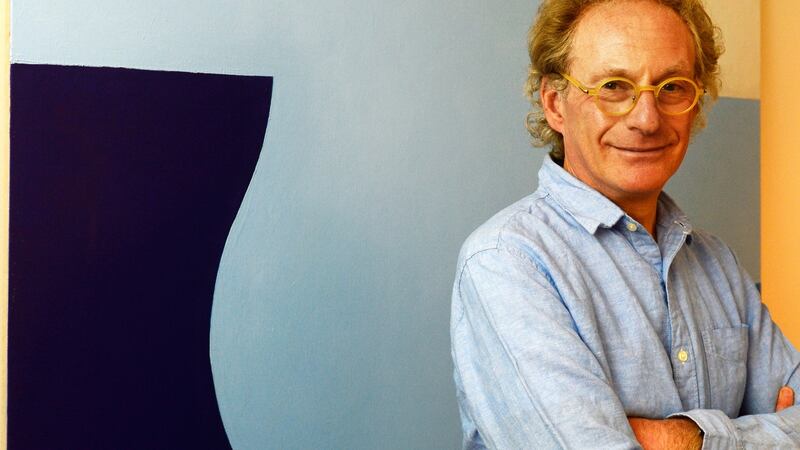 Anthony Peto at his  home in Sandymount with a painting by Richard Gorman. Photograph: Cyril Byrne