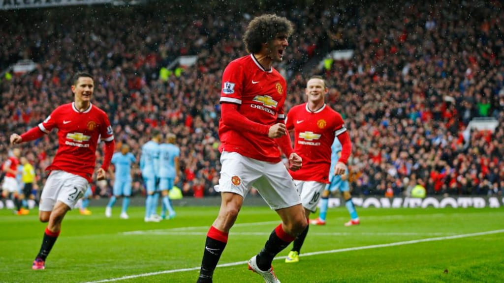 Marouane Fellaini celebrates scoring the second goal for Manchester United. Photo: Darren Staples/Reuters