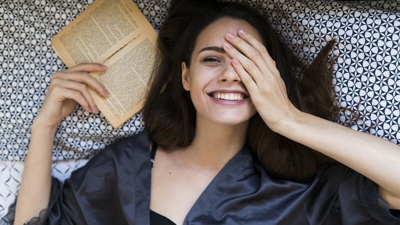 I want a list of books that are guaranteed to distract and entertain me, that will put a smile back on my face, that might even make me laugh out loud. Photograph: Getty Images