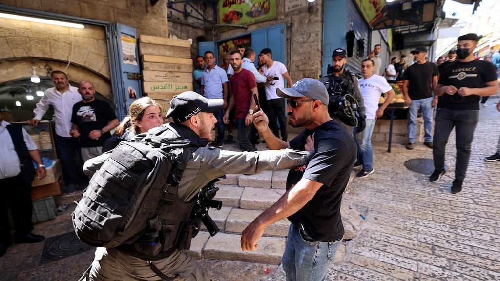 An Israeli border police member confronts a Palestinian man during protests at Damascus Gate in East Jerusalem, on May 18th. Photograph: Emmanuel Dunand/AFP via Getty Images