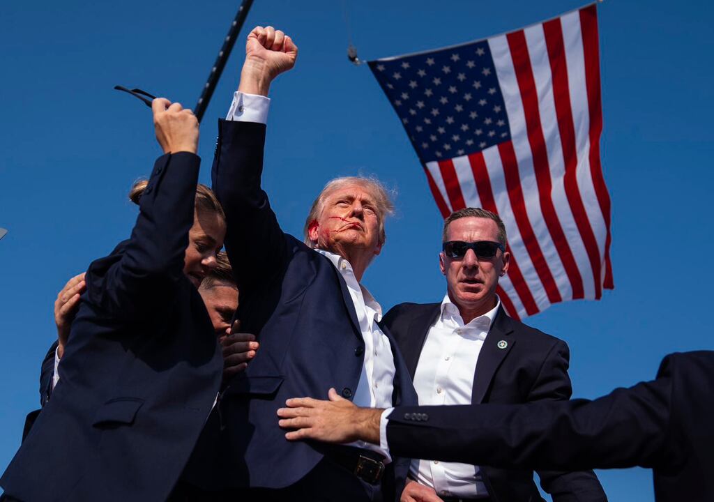Donald Trump raises his fist as he is rushed off stage after an assassination attempt during a campaign rally in Butler, Pennsylvania, on July 13th last year. Photograph: Evan Vucci/AP