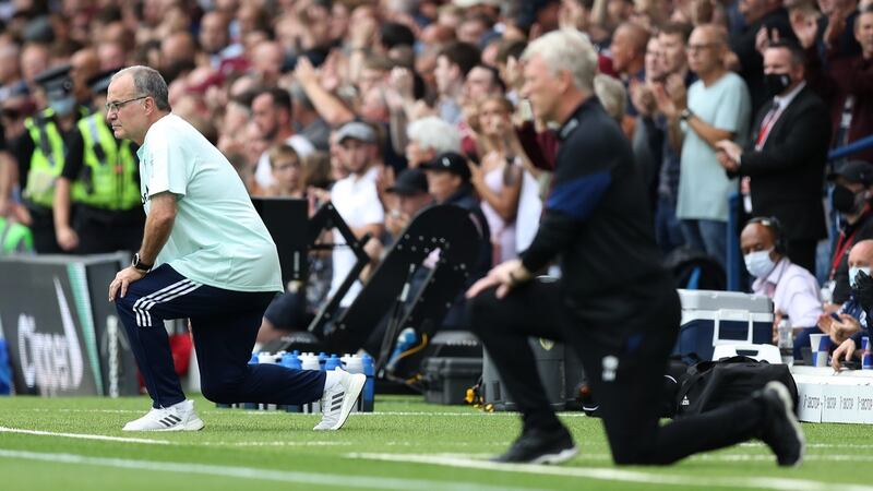 Marcelo Bielsa and David Moyes take a knee in support of the Black Lives Matter movement. Photograph: George Wood/Getty Images