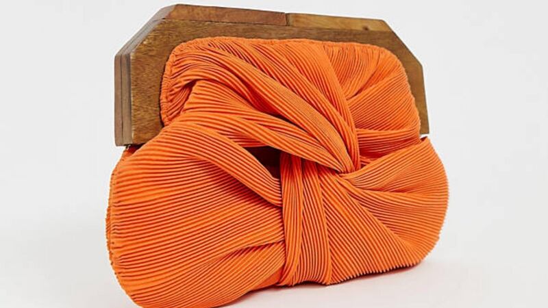 Orange pleated clutch Asos. €48.39