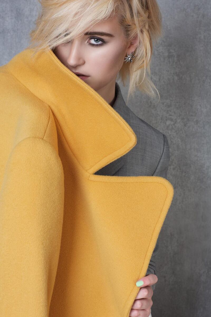 Mustard coat, €450, Max & Co., Arnotts; jacket (part of suit) €746, Brown Thomas; earrings €199, Loulerie.