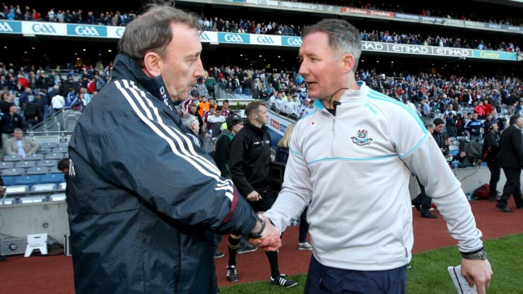 Westmeath Manager Pat Flanagan and Dublin Manager Jim Gavin shake hands after the game. Photograph: Ryan Byrne/Inpho