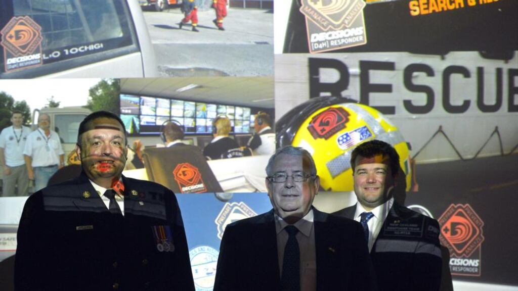 Alberta Fire Commissioner Trent West, Minister for Trade and Development Joe Costello and Robin Blandford, CEO, Decisions.