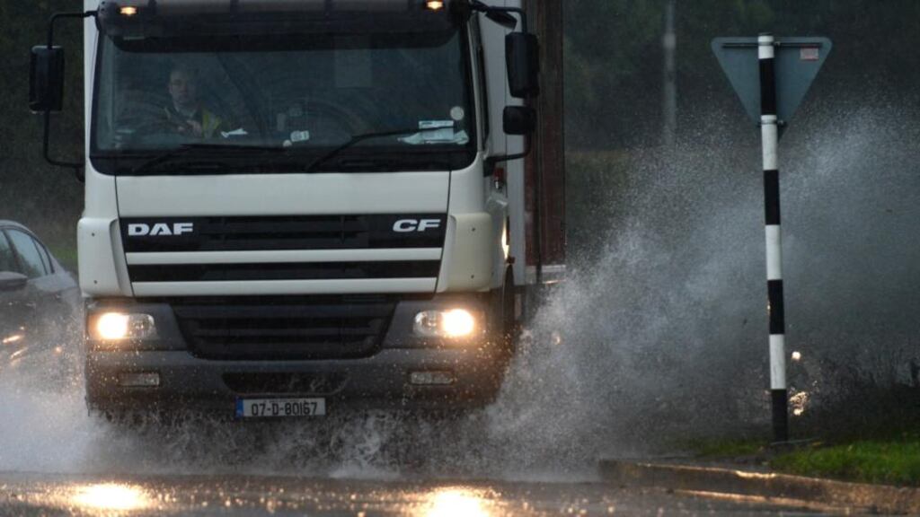 A lorry drives through flooding on the Swords Road in Co Dublin earlier this week after heavy rain. Photograph: Dara Mac Dónaill/The Irish Times
