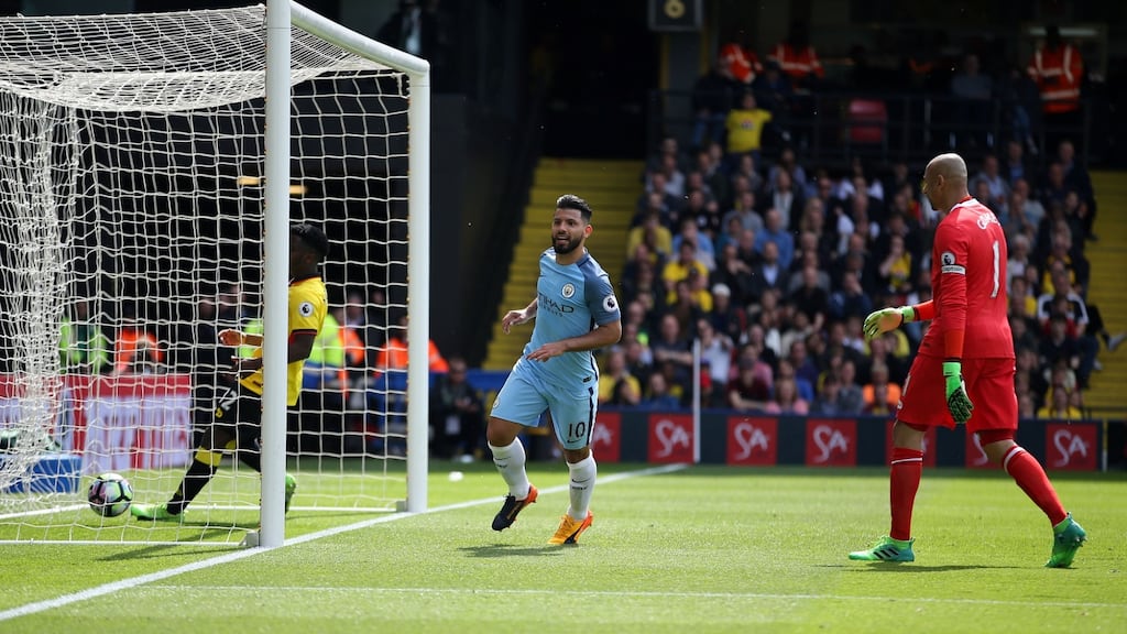 Sergio Aguero scores Manchester City’s third during their final day hammering of Watford. Photograph: Steven Paston/PA