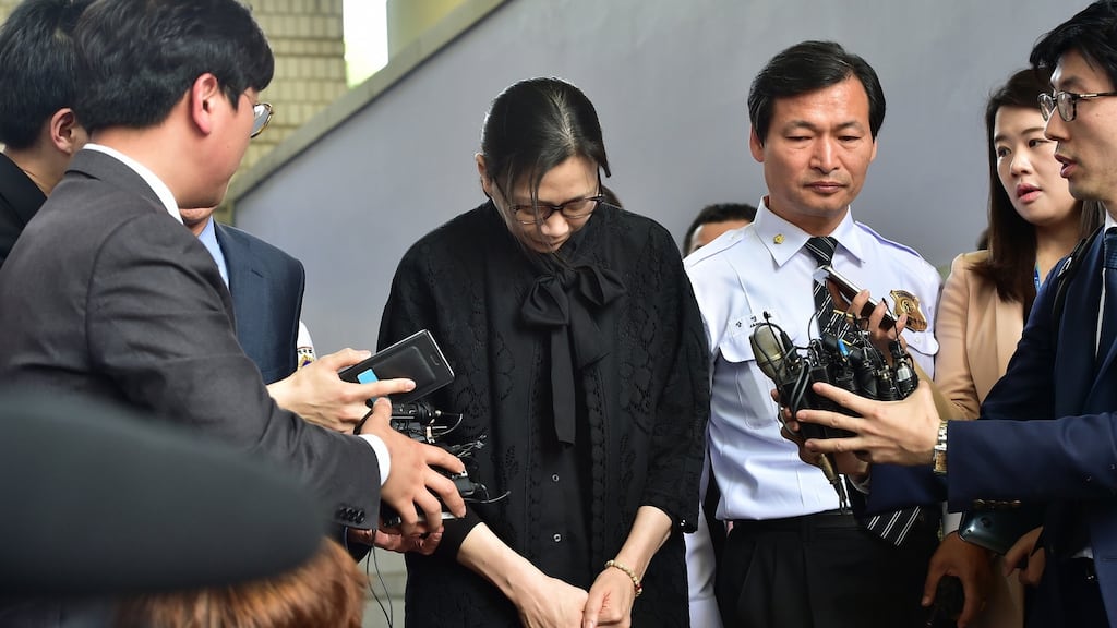 Former Korean Air executive Cho Hyun-Ah surrounded by journalists after she was freed by a Seoul appeals court in May2015, following her jailing for disrupting a flight in a rage over macadamia nuts. Photograph:  Jung Yeon-Je/AFP/Getty Images