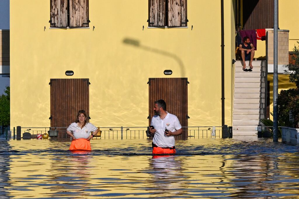 Rescuers patrol a flooded street  in Conselice, near Ravenna, earlier this week after deadly floodwaters hit the Emilia-Romagna region (Photo by Andreas Solaro / AFP)