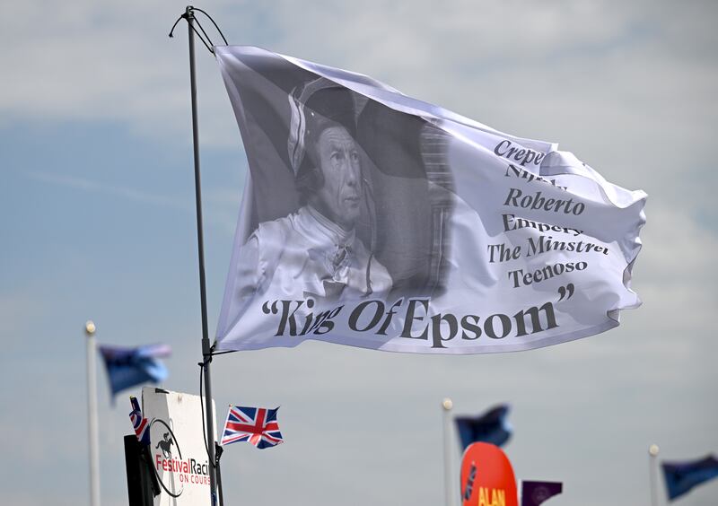 Flags featuring Lester Piggott flutter at Epsom in June. Photograph: Leon Neal/Getty Images
