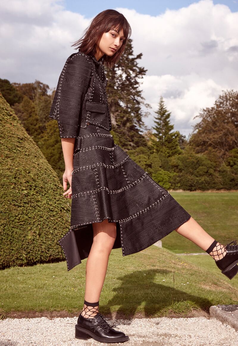 Jacket €2260, skirt €1715 NoirKei Ninomiya, brogues €780 Simone Rocha, socks, stylist’s own.