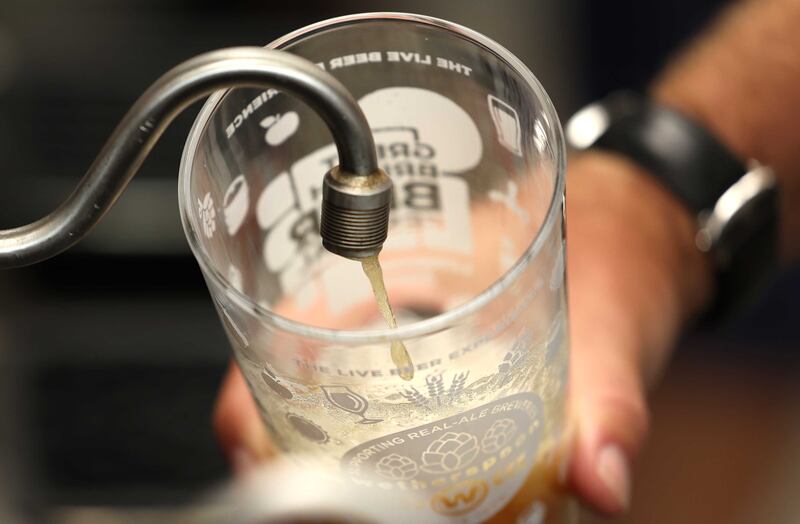 Stonegate Group, the UK's largest pub owner, is to charge more for pints during peak hours. PHotograph: Neil Hall/EPA-EFE