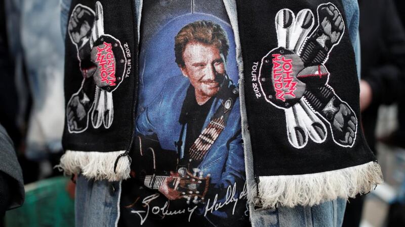 Elvis Presley of France: Johnny Hallyday on a fan’s clothes. Photograph: Benoit Tessier/Reuters