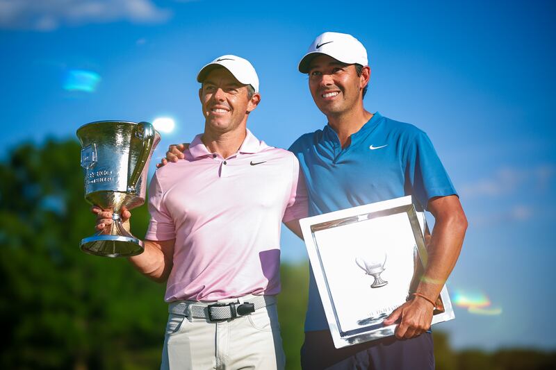 Rory McIlroy and his caddie Harry Diamond celebrate with the trophy after winning the Wells Fargo Championship at Quail Hollow Club in Clifton, North Carolina in May 2024. Photograph: Jared C Tilton/Getty Images