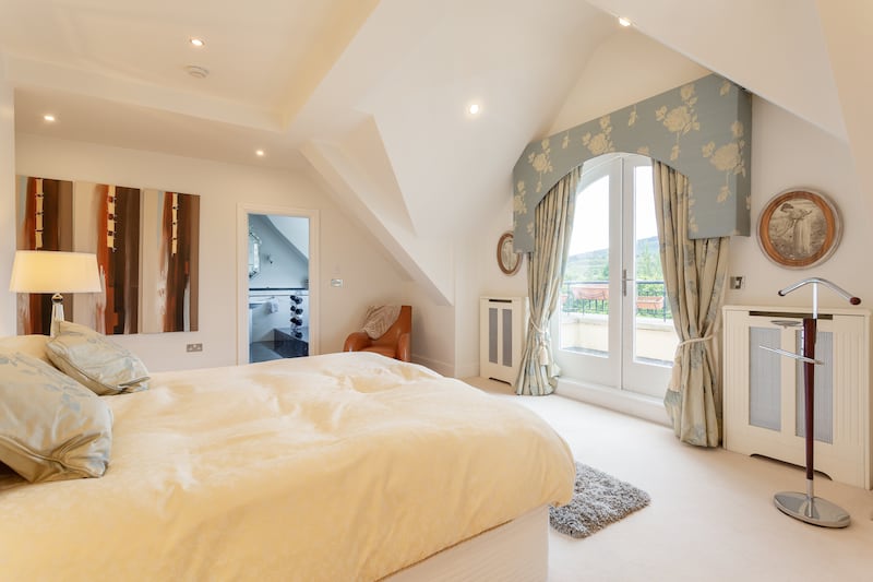 The main bedroom boasts a private balcony with views over the Dublin mountains