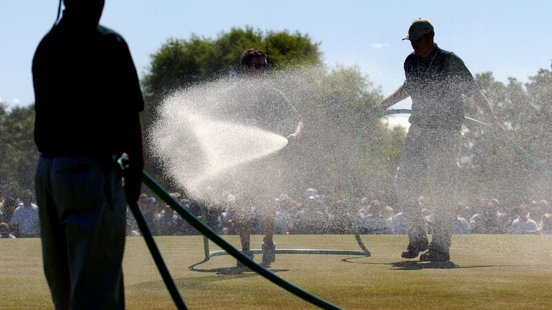 The water team douses the seventh green during the final round. Photo: A. Messerschmidt/Getty Images
