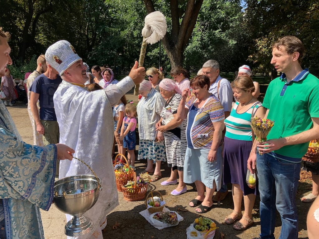 Fr Vasily Vyrozub performs a symbolic blessing of fruit. Photograph: Ed Vulliamy