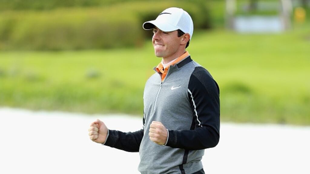 Rory McIlroy celebrates on the 18th green after winning the 2016 Irish Open. Photograph: Andrew Redington/Getty Images