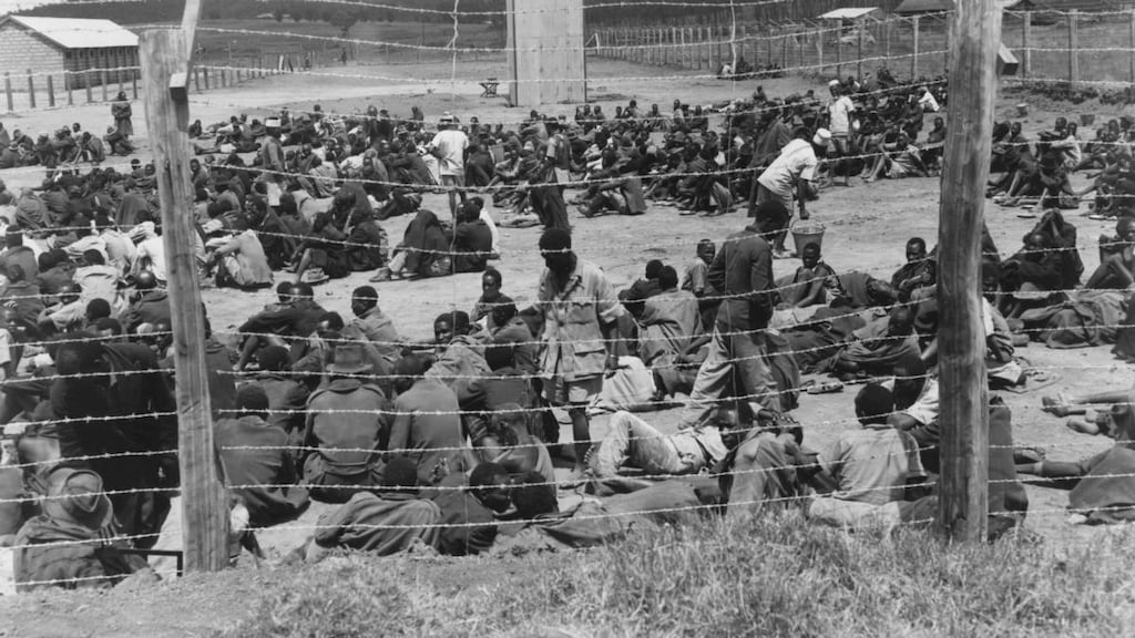 Kikuyu tribe members held in an internment camp by the British government, during the Mau Mau rebellion: Atrocities raise “unanswered questions about violence in the British empire”. Photograph: Hulton-Deutsch/Hulton-Deutsch Collection/Corbis via Getty Images)