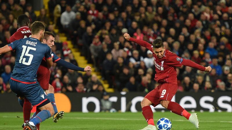 Liverpool’s Roberto Firmino opens the scoring in the Champions League Group C match against Red Star Belgrade at Anfield. Photograph: Oli Scarff/AFP/Getty Images