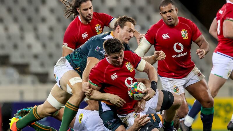 Lions flanker Tom Curry is tackled by Nicolaas Janse van Rensburg of South Africa A. Photograph: Billy Stickland/Inpho