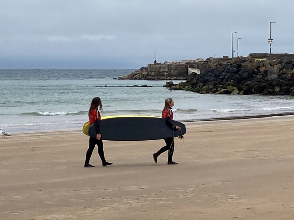 Visitors continued to come to the seaside town of Portrush on Northern Ireland's north coast despite rain showers bringing the heatwave to an abrupt end. Photograph: PA Wire
