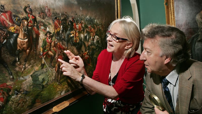 Professor Niamh O’Sullivan and James Gorry, a restoration specialist, discussing a detail in The Battle of Aughrim by John Mulvany, at the Gorry Gallery in Dublin. Photograph: Matt Kavanagh
