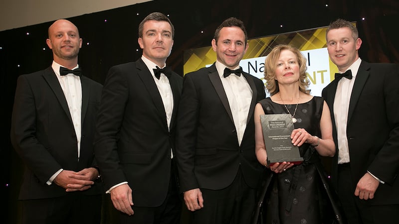Wayne Dignam, Managing Director, Tender Team presents the International Procurement Project of the Year award to the Exertis Supply Chain Services team