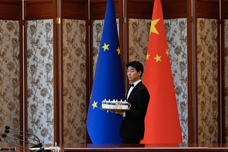 A staff member prepares for the arrival of officials in advance of a recent China-EU meeting Beijing. Photograph: Wang Zhao/ AFP