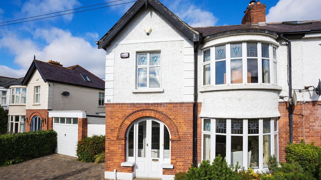 The reception hall has three panels with leaded, coloured glass to the front, a good-sized guest cloakroom and dado rail.