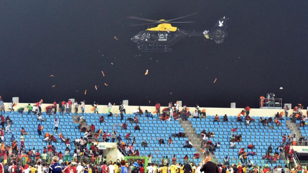 A police helicopter flies over the stadium during an interruption to the African Cup of Nations semi-final match between hosts Equatorial Guinea and Ghana in Malabo. Photograph: Issouf Sanogo/AFP/Getty Images
