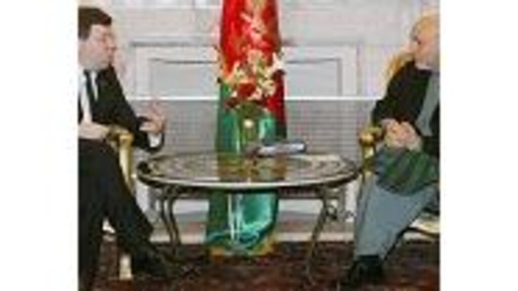 Mr Cowen with Afghan President Hamid Karzai at the presidential palace in Kabul yesterday. Photograph: Reuters