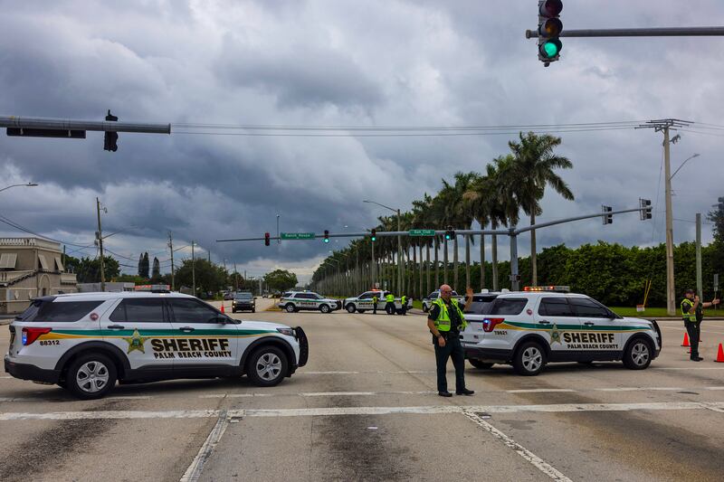 Police block off a road near Trump International Golf Club following the incident. Photograph: Saul Martinez/The New York Times