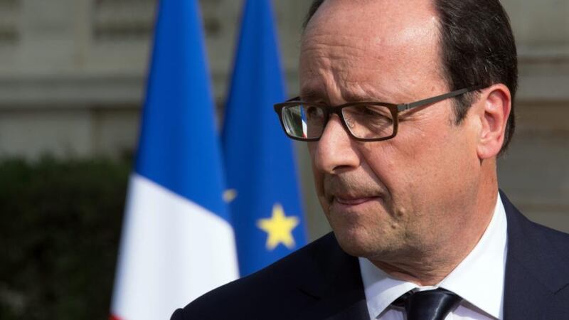French president Francois Hollande delivers a speech outside the Foreign Affairs ministry in Paris yesterday, after meeting families of the victims of Air Algerie flightcrash, that killed 118 people including 54 French citizens. Photograph: EPA