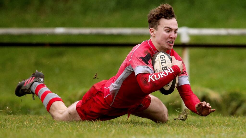 Glenstal’s Ronan Quinn crosses for a try against Bandon Grammar at the Mardyke. Photograph: Tommy Dickson/Inpho