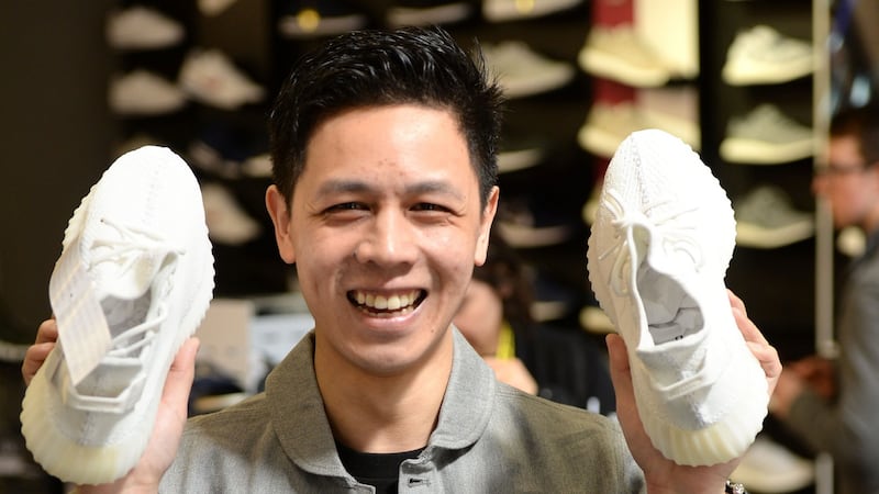 Simon Wai, a self-confessed sneakerhead from Marino, Dublin, with the Yeezy Boost 350 by Adidas/Kanye West at a JD Sports, in Dublin. Photograph: Dara Mac Dónaill
