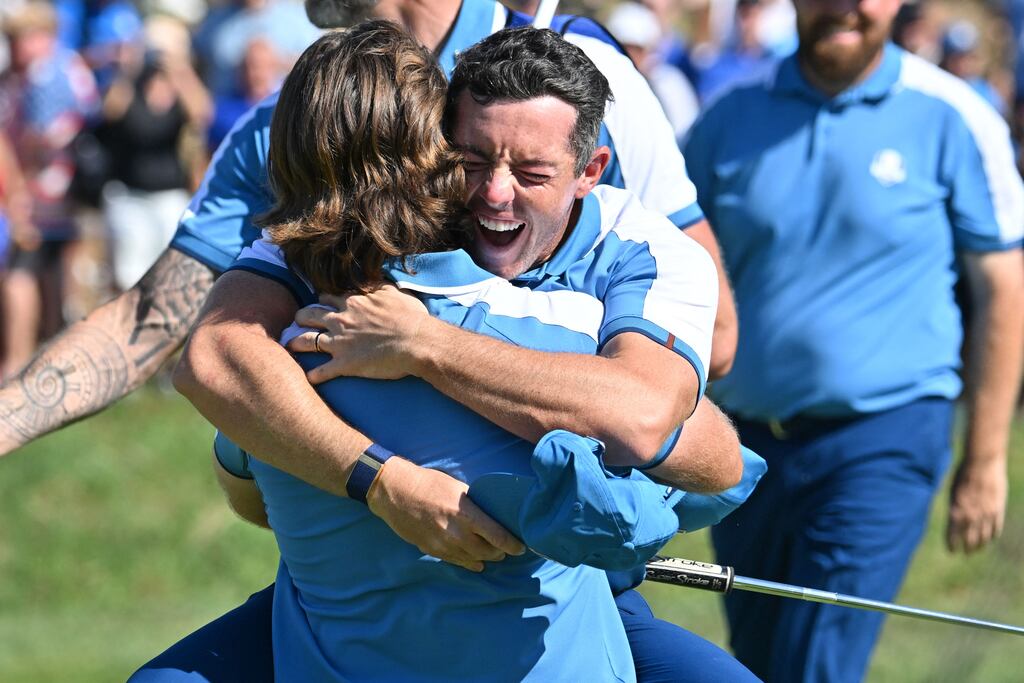 Ireland's Rory McIlroy with Tommy Fleetwood as they celebrate their 2&1 win over Xander Schauffele and Patrick Cantlay on Friday morning. Photograph: Getty Images