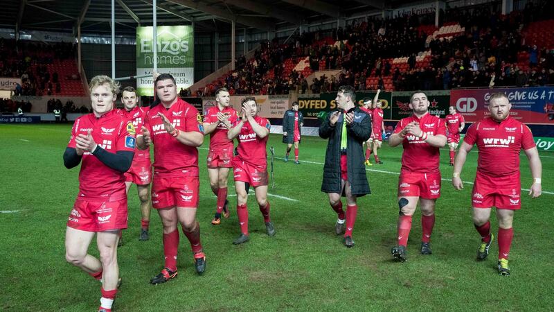 Scarlets celebrate sealing their quarter-final place with an exciting victory over Toulon at Parc y Scarlets, Llanelli. Photograph: Morgan Treacy/Inpho