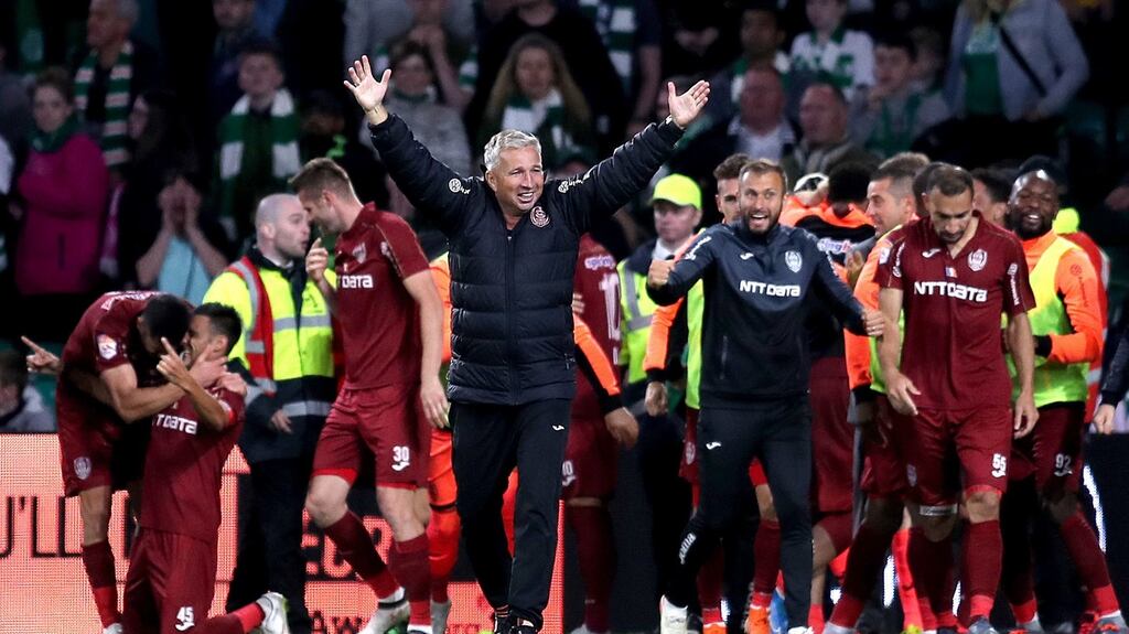 CFR Cluj manager Dan Petrescu celebrates his side’s victory over Celtic at Parkhead. Photograph: Jane Barlow/PA