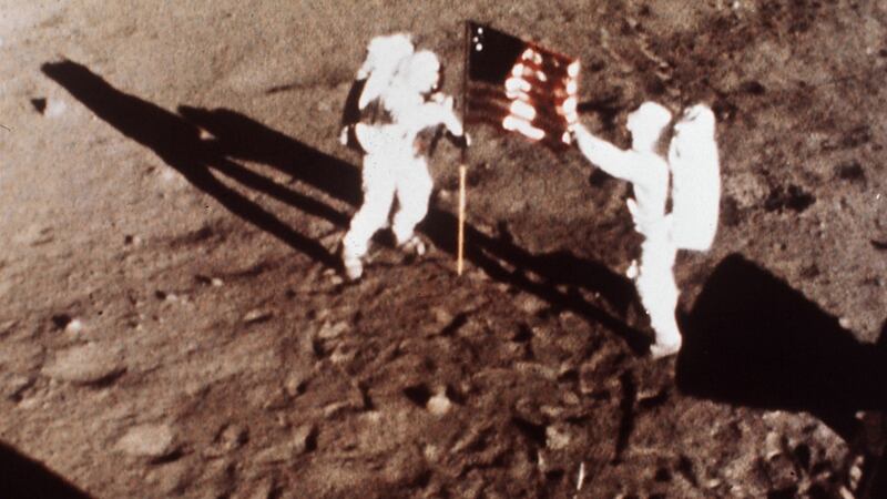 Apollo 11 astronauts Neil Armstrong and Buzz Aldrin, the first men to land on the moon, plant the American flag on July 20th, 1969. This photo was taken by a 16mm movie camera inside the lunar module, shooting at one frame per second. Photograph: AP/Nasa