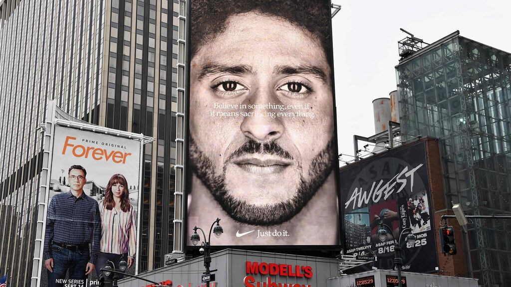 A Colin Kaepernick Nike advert shown in New York City. Photograph: Angela Weiss/AFP/Getty
